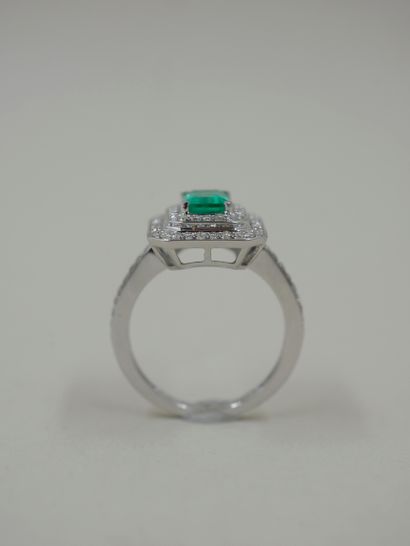 null Rectangular ring in 18k white gold set with a rectangular emerald weighing approximately...