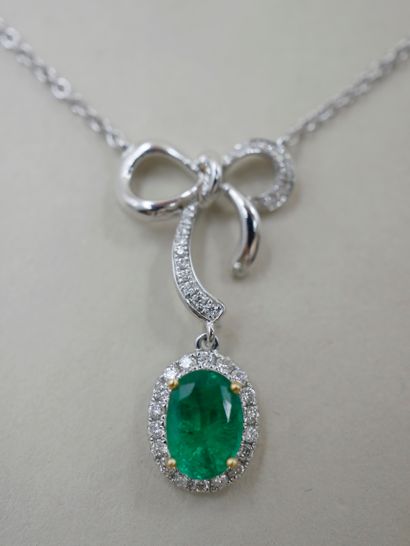 null Necklace in 18k white gold holding in pendant a bow paved with brilliants and...