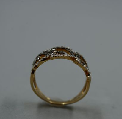 null 18k yellow gold ring with openwork waves paved with brown and white diamonds...