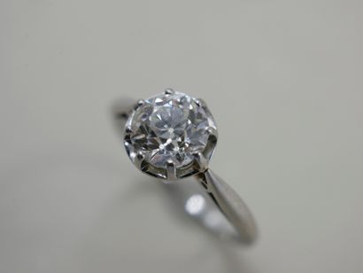 null Solitaire ring in platinum set with an old cut diamond weighing approximately...