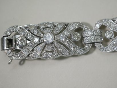 null Art Deco bracelet in 18k white gold composed of four openwork links paved with...