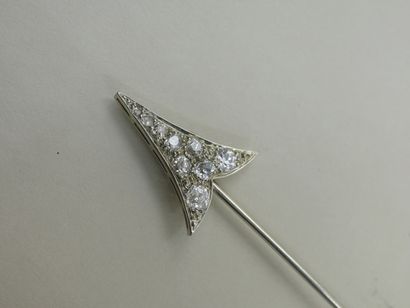 null 
Platinum scarf pin representing an arrow with a white heart-shaped baroque...