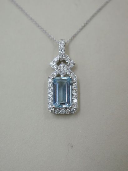 null Necklace in 18k white gold holding a rectangular pendant adorned with an emerald-cut...