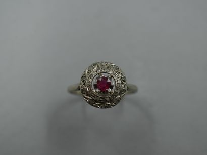 null 18k white gold ring with a red stone in a double circular braided setting paved...