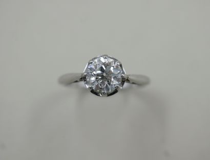 null Solitaire ring in platinum set with an old cut diamond weighing approximately...