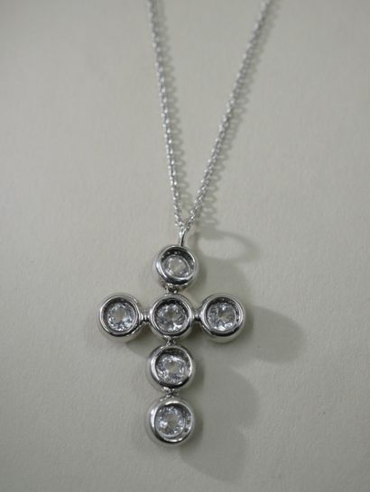 null Necklace in 18k white gold holding in pendant an articulated cross, set with...