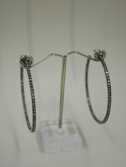 null 
Pair of large 14k yellow and blackened gold hoop earrings, paved with diamonds....
