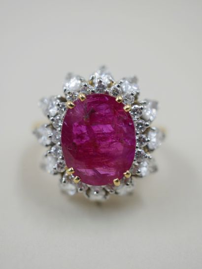 null 
18k yellow and platinum flower ring set with an oval unheated Burmese ruby...