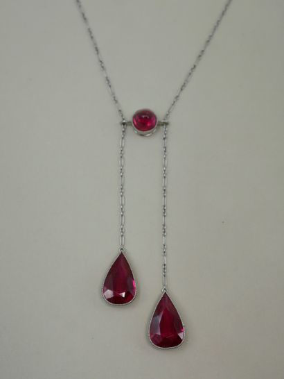 null 
Platinum white gold with two faceted synthetic rubies in the form of a drop...