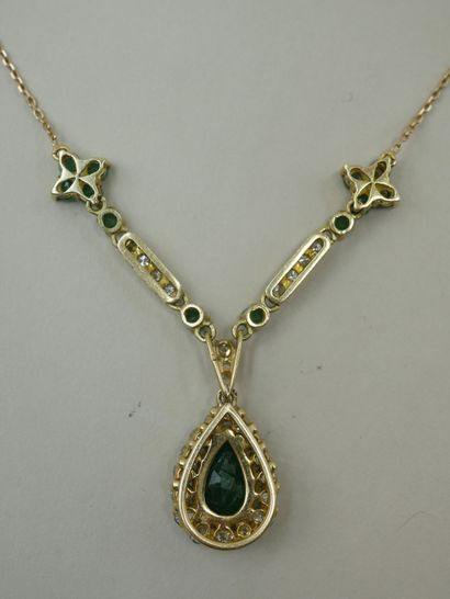 null Necklace in 18k yellow gold with a pendant set with a pear cut emerald of about...