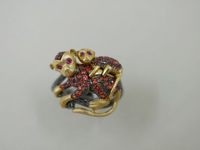 Yellow gold and blackened 18k gold ring representing...