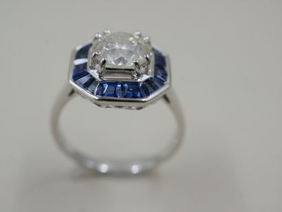 null Art Deco style ring in 18k white gold surmounted by a diamond of 1.50cts surrounded...