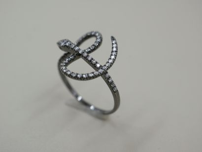 null Blackened 18k gold ring with a line of diamonds representing a snake - PB :...
