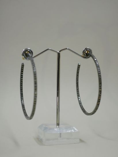 null 
Pair of large 14k yellow and blackened gold hoop earrings, paved with diamonds....