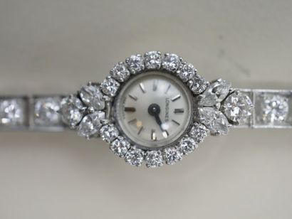 null LONGINES - Lady's watch bracelet in platinum - The circular dial, bezel adorned...