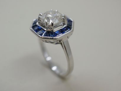 null Art Deco style ring in 18k white gold surmounted by a diamond of 1.50cts surrounded...