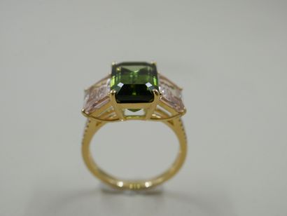 null 
18k yellow gold ring set with a rectangular tourmaline of about 5 ct. and two...