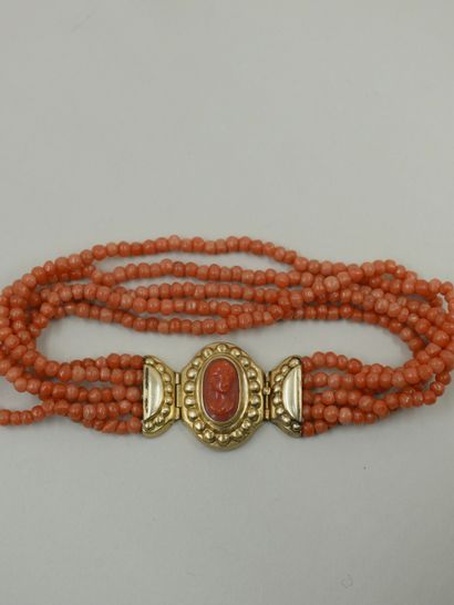 null 18k yellow gold bracelet holding 5 rows of coral beads, the clasp set with a...