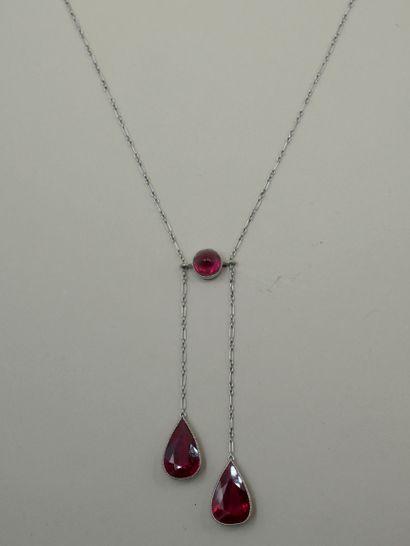 null 
Platinum white gold with two faceted synthetic rubies in the form of a drop...