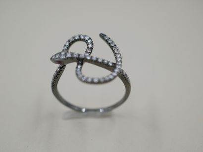 null Blackened 18k gold ring with a line of diamonds representing a snake - PB :...