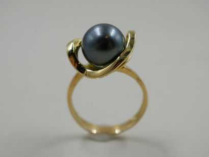 null 18k yellow gold ring with a Tahitian pearl 11mm diameter - PB : 7,42gr - TDD...