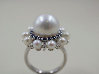 null Daisy ring in 18k white gold set with a large white cultured pearl encircled...