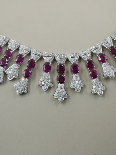 null 18k white gold drapery necklace entirely set with oval rubies for a total weight...