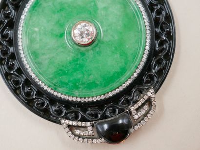 null Pendant composed of a circular jade plate centered by a half-cut diamond of...