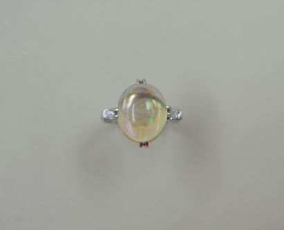 null NOT SOLD - Ring in 18k white gold with a cabochon opal and baguette diamonds...