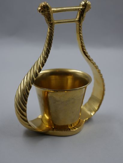null HERMES - Pencil pot in gilded metal enclosed in a twisted lyre motif surmounted...
