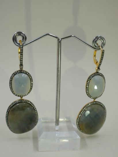 A pair of silver and 18k yellow gold earrings...
