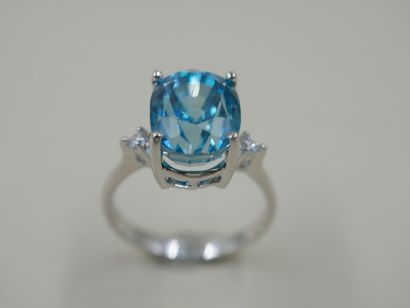 null 18k white gold ring set with a natural oval zircon weighing 8.96cts, with a...