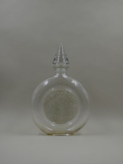 null GUERLAIN "Mitsouko

Bottle model watch, label titled "Mitsouko Eau de Cologne"....