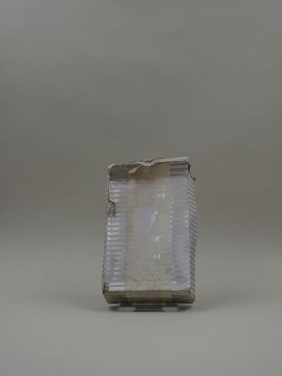 null DANA "Platinum

Sculptural bottle, silver label, titled. Silver screw cap. Inside...