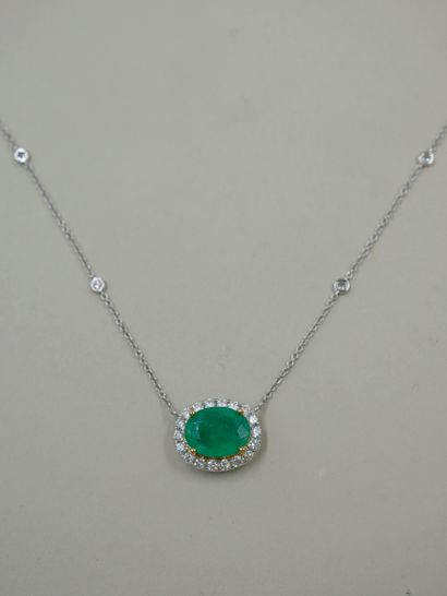 null Necklace in white gold and 18k yellow gold set with an emerald weighing about...
