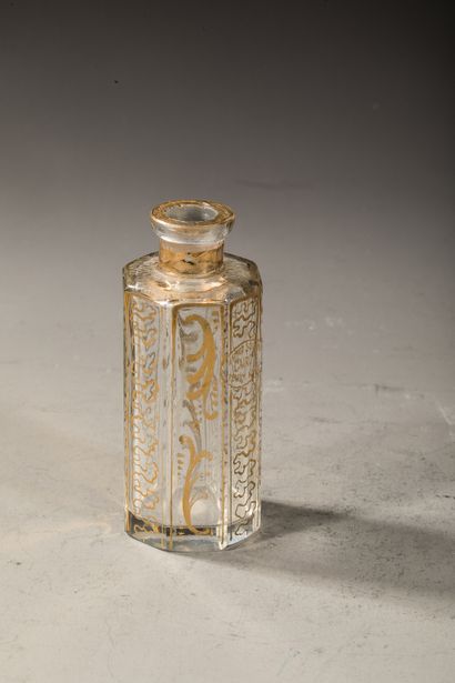 null AHMED SOLIMAN Glass bottle of octagonal form, with Egyptian decoration on each...