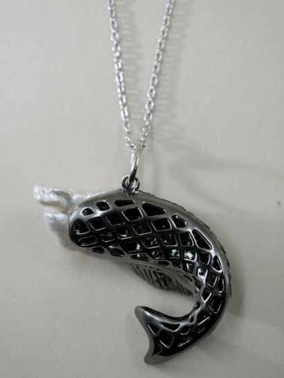 null An 18k white and blackened gold pendant in the shape of a fish, the scales paved...