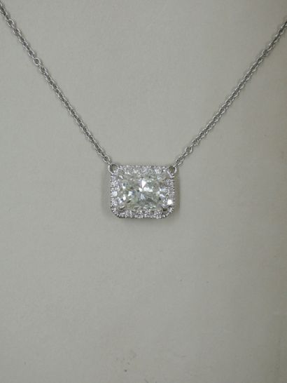 null Necklace in 18k white gold set with a cushion cut diamond weighing about 2cts...