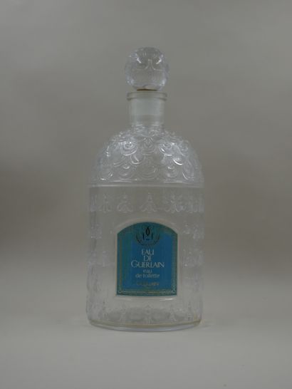 null GUERLAIN "Eau de Guerlain

Colorless bee bottle, label titled "Eau de Guerlain"....