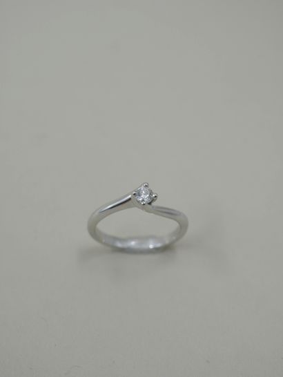 null 18k white gold tourbillon ring set with a 0.15ct round diamond in F/G colour...