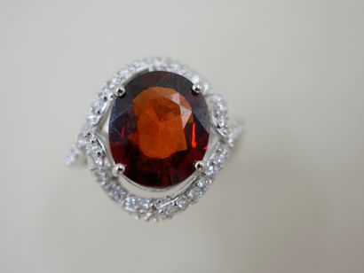 18k white gold ring set with a 5cts spessartite...