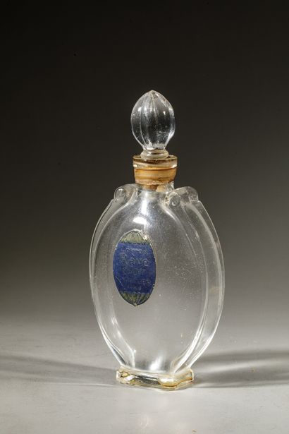 null L.T PIVER " Rêve d'Or " Oval glass bottle on pedestal. Emeralded stopper of...