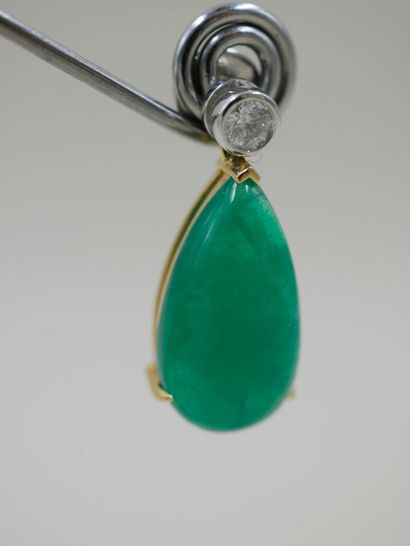 null Pair of 18k yellow gold and platinum earrings each with a pear cut emerald cabochon...