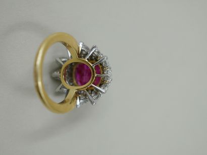 null 18k yellow gold and platinum flower ring set with an oval unheated Burmese ruby...