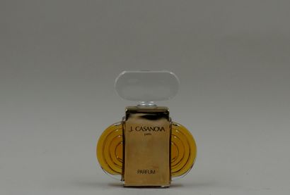 null CASANOVA PARIS glass bottle with a sculptural shape, dressed with two gilded...