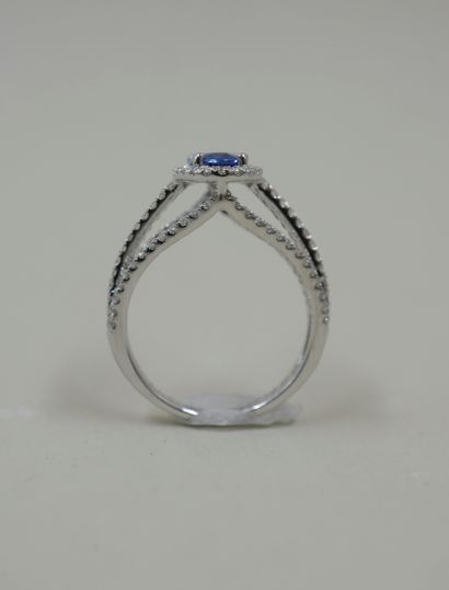 null Ring in 18k white gold, the setting with three strands paved with diamonds and...