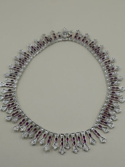 null 18k white gold drapery necklace entirely set with oval rubies for a total weight...
