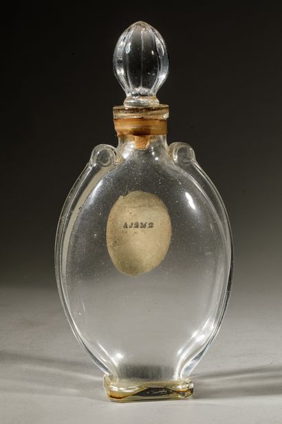 null L.T PIVER " Rêve d'Or " Oval glass bottle on pedestal. Emeralded stopper of...
