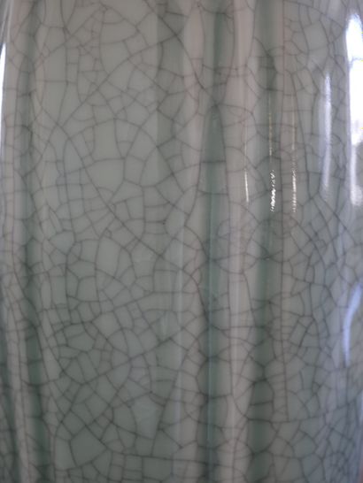 null A celadon crackled porcelain lamp base with gadroons imitating a gourd, in the...