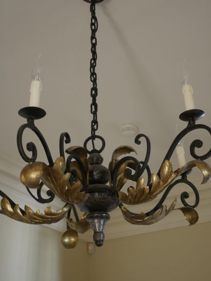 null Gilded wrought iron chandelier with five arms of light decorated with volutes...